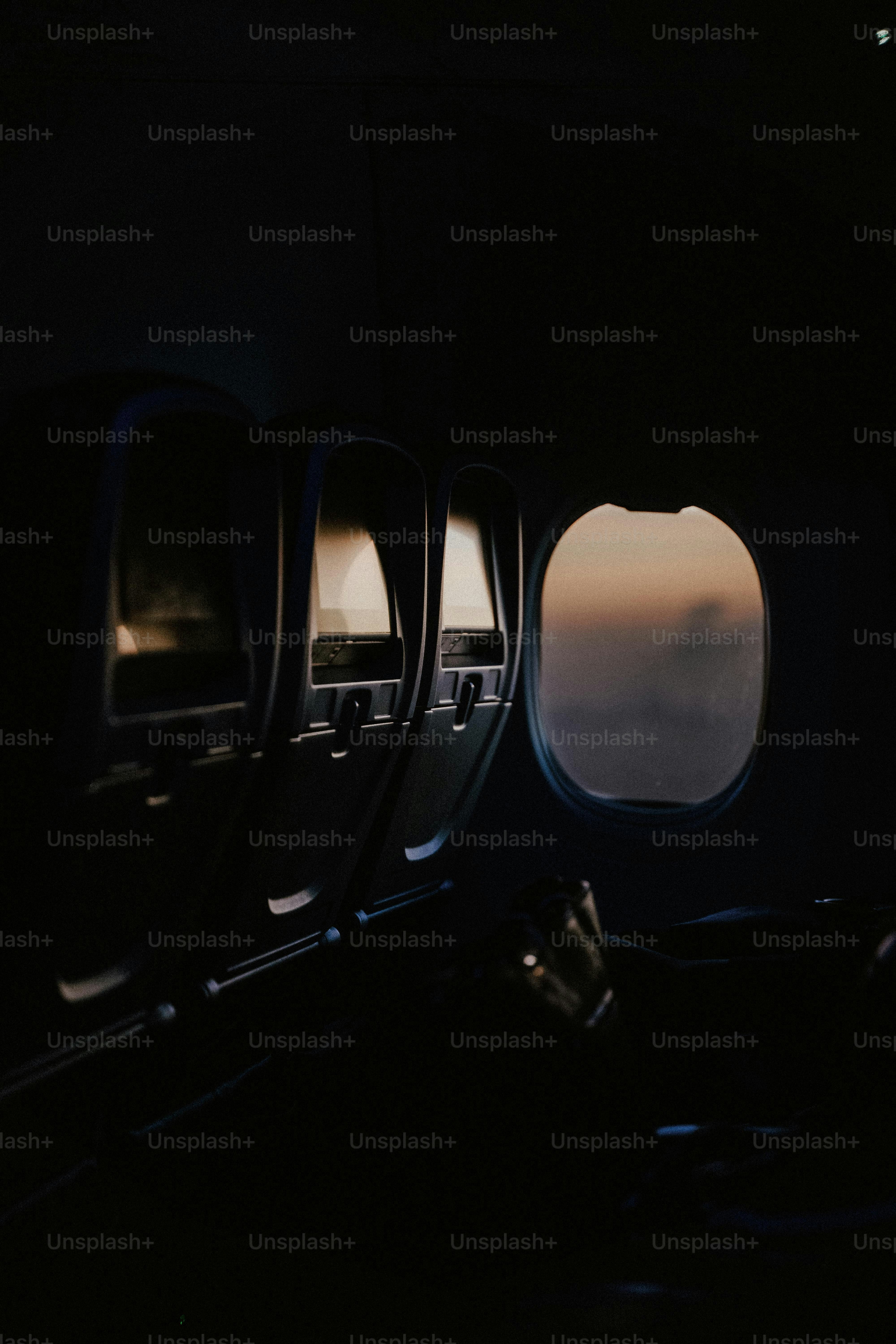 a view of the wing of an airplane through the window